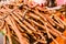 Stacks of dried licorice branches for sale