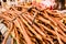 Stacks of dried licorice branches for sale