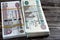 Stacks of Egypt money banknote bills of 100 and 50 EGP LE one hundred Egyptian and fifty Pounds  on wood features Sultan