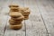 Stacks of fresh baked oat cookies on rustic wooden table background