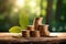 Stacks of gold coins with fresh green leaf on a wooden surface. bokeh green background with warm sunlight. Green Investment Growth