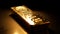 Stacks of gold ingots illuminate banking success generated by AI