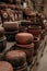 Stacks of handmade ceramic red clay brick pots for plants in a greenhouse or for cooking 1
