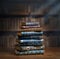 Stacks of old books on wooden desk in old library. Ancient books historical background. Retro style. Conceptual background on