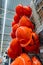 Stacks of orange safety construction helmets in the store