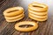 Stacks of oval bread rings on wooden table