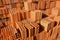 Stacks of red and brown clay bricks and blocks for general construction and reform