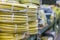 stacks of rolls yellow pvc plastic pipe on the counter in the store. Sale Hoses in the garden of various manufacturers, on shelves