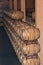 Stacks and rows of wine barrels in spanish wine cellar