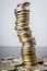 Stacks of Russian coins on a gray background with droplets of water.