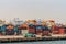 Stacks of shipping containers and trucks at Laem Chabang Thailand