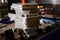 Stacks of silver metal plates on tray at production plant