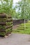 stacks of sod rolls for new lawn for landscaping. Lawn grass in rolls on pallets. rolled grass lawn is ready for laying