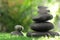 Stacks of stones on green grass against  background, space for text. Zen concept