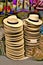 Stacks of straw hats for sale in store