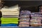 Stacks of towels on a store shelf. Showcase with textiles for personal hygiene