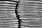 Stacks of US American coins of 25 cents quarters closeup. Black and white background or wallpaper about economy finance banks in