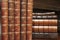 Stacks of various antique books