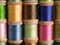 Stacks of Vintage Threads on Wooden Spools