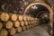 Stacks of wine barrels filled with red wine ageing in the underground tunnels of Ribera del Duero wine region north of Madrid #2