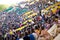 Stadium in Bamako filled with many children looking at a soccer