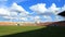 Stadium, cloud and shadow moving.