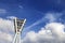 Stadium Lighting Tower & Cloudy Blue Sky