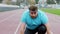 At the stadium obese man very charismatic and excited at the starting line start to run fast he want to loose the weight