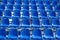 Stadium seats background. Rows of blue plastic empty chairs