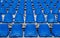 Stadium seats background. Rows of blue plastic empty chairs