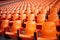 Stadium solitude Rows of empty orange seats in soccer arena