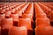 Stadium solitude Rows of empty orange seats in soccer arena