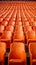 Stadium solitude Rows of empty orange seats in soccer arena