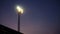 The Stadium Spot-light tower over football field at night time.
