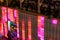 Stadtfest Brugg 24th of august 2019. street photography. Red and pink illuminated plastic wall of Kubus Kolor with people on the