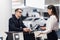 Staff At Airport Check In Desk Handing Ticket To Businessman