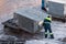 Staff of the airport manipulate the freight container.