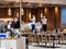 Staff at Ding Tai Fung Chinese restaurant in Singapore clean / disinfect / sanitize the premises while wearing masks as a covid-19