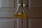 Staff only gold label hanging on knob in front of room