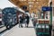 Staff talking on platform next to The Poppy Line steam train, Sheringham, Norfolk, UK