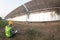 Staff in uniforms and helmets are checking and recording in the journal of the parabolic solar rail.