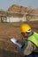 Staff in uniforms and helmets are checking and recording in the journal of the parabolic solar rail.