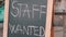 Staff wanted chalk board sign. Vacancy sign on black chalkboard. Headhunter concept. Job hire concept.