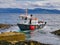 The Staffa Trips tourist boat Fingal, with tourists aboard, approaches moorings on the island of Staffa in Scotland