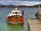 The Staffa Trips tourist boat Iolaire of Iona approaches the quayside on Iona