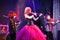 On stage, the expressive red-haired violinist Maria Bessonova sons twins. violin trio two generations of red fiery musicians.