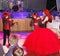 On stage, the expressive red-haired violinist Maria Bessonova sons twins. violin trio two generations of red fiery musicians.