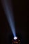 Stage lights. Several projectors in the dark. Multi-colored light beams from the stage spotlights on the stage in the smoke at the