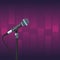 Stage microphone over purple background