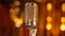 Stage spotlight illuminates shiny chrome condenser microphone background